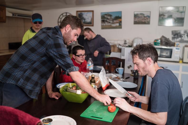 Disability worker helping client in the kitchen