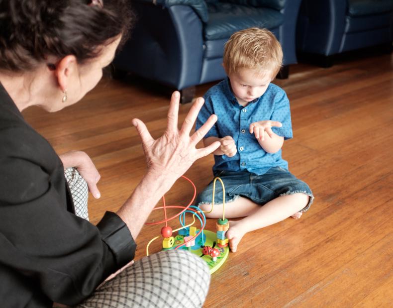 Disability worker interacting with young person with disability