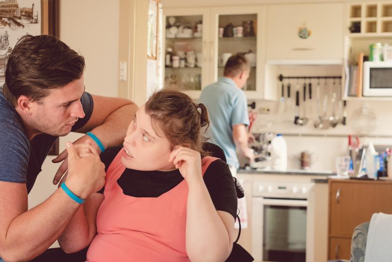 Disability worker with person with disability